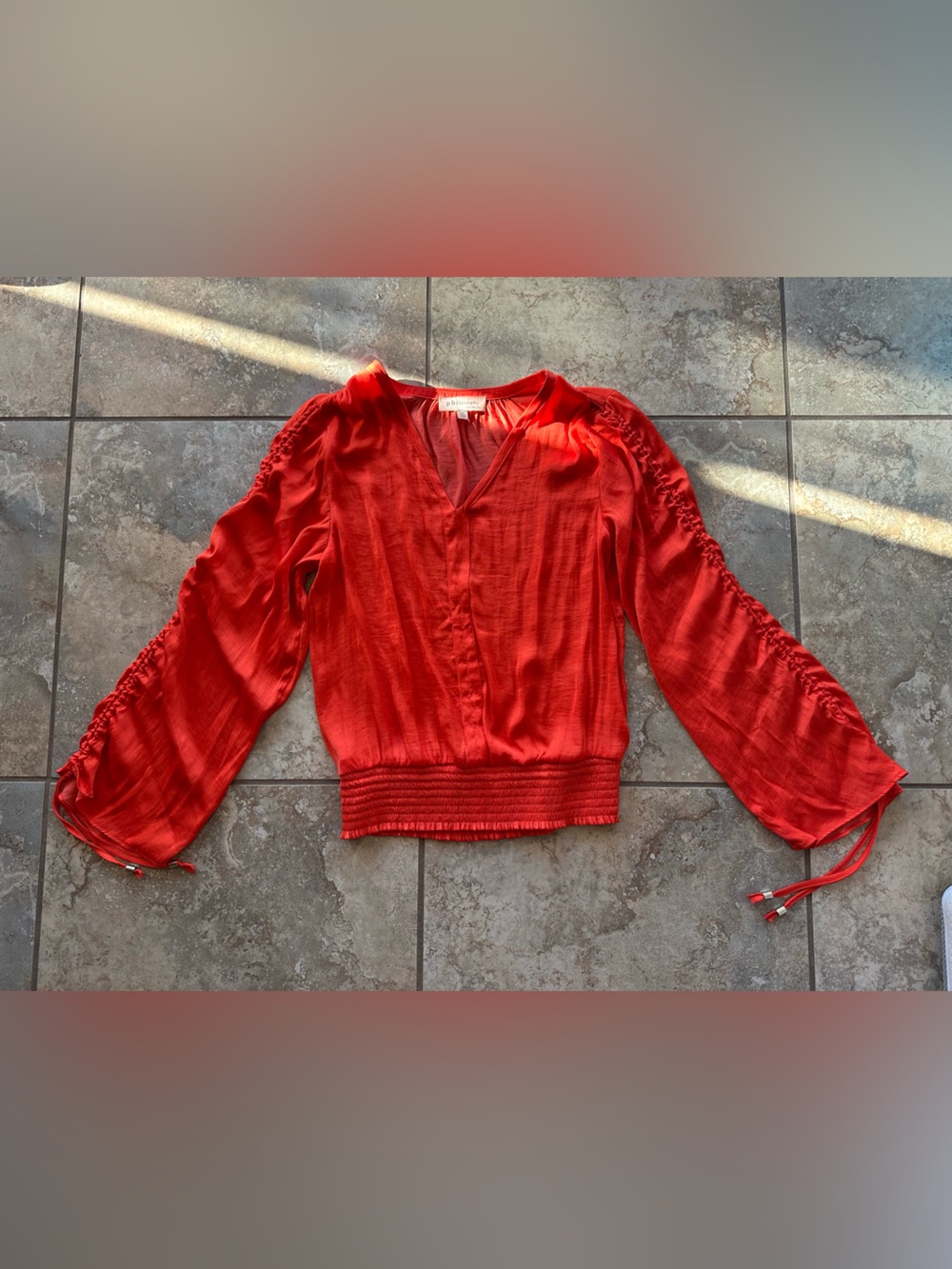Women’s Red V-Neck Smocked Waist Blouse with adjustable sleeves